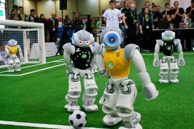 Two robots are fighting for the ball